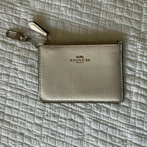 Coach zippered card holder with clip. cream/off white leather